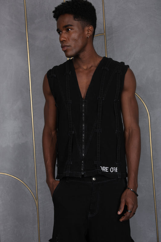 Person wearing a black sleeveless Vest with 'ORE OFE' branding on a gray background