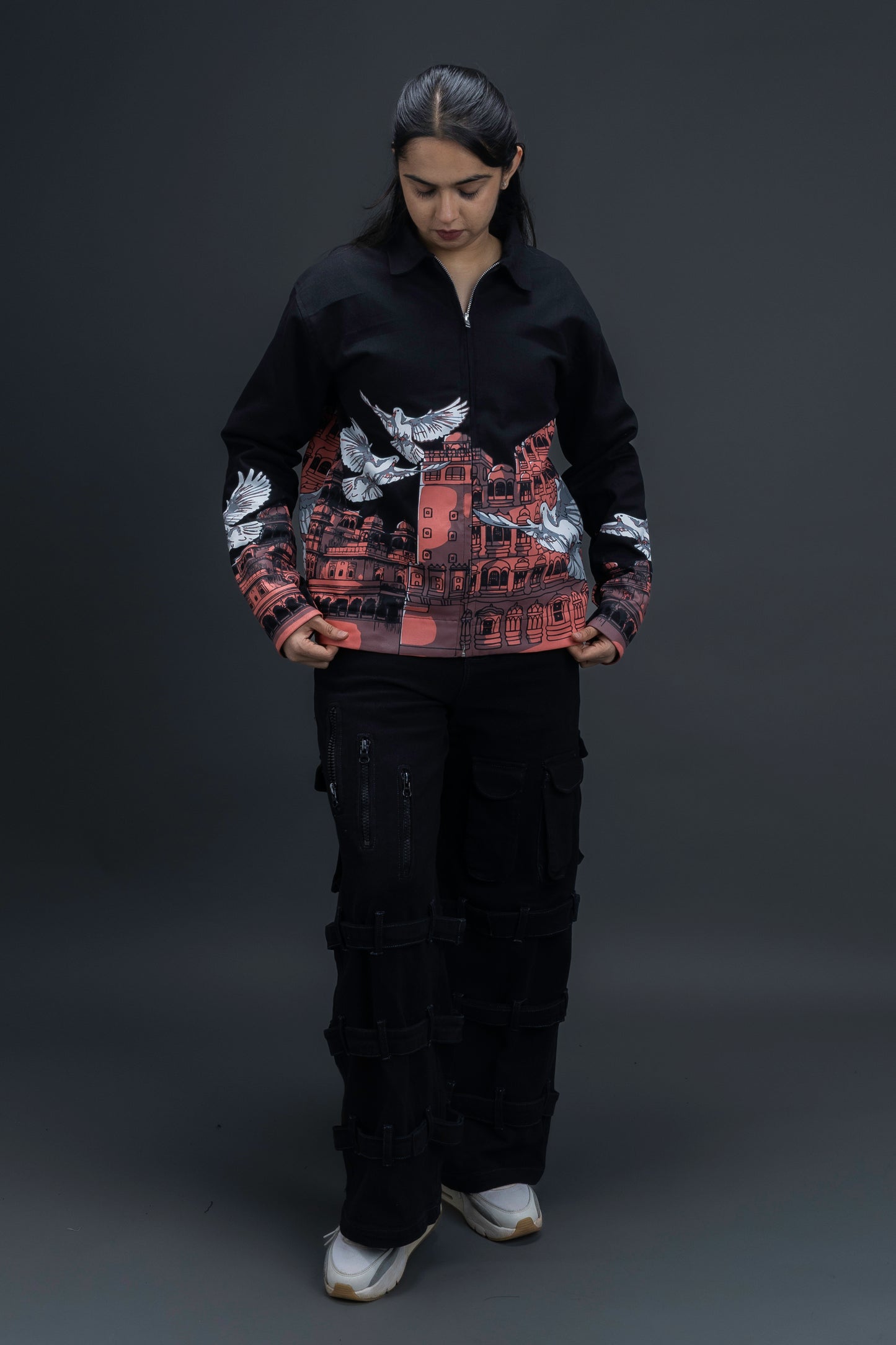 Person wearing a black heritage jacket by ORE OFE that is designed with the theme of Hawa Mahal