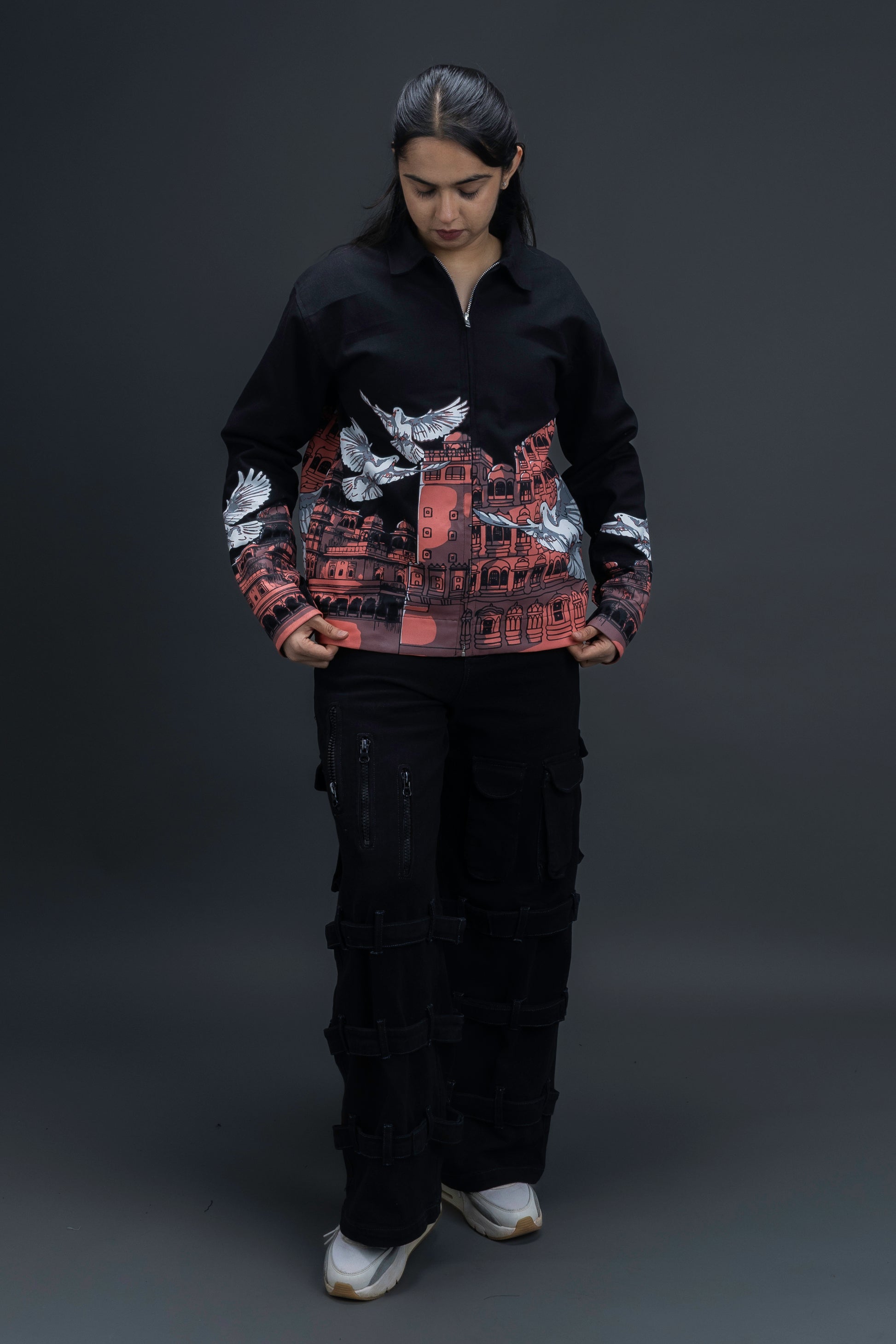 Person wearing a black heritage jacket by ORE OFE that is designed with the theme of Hawa Mahal