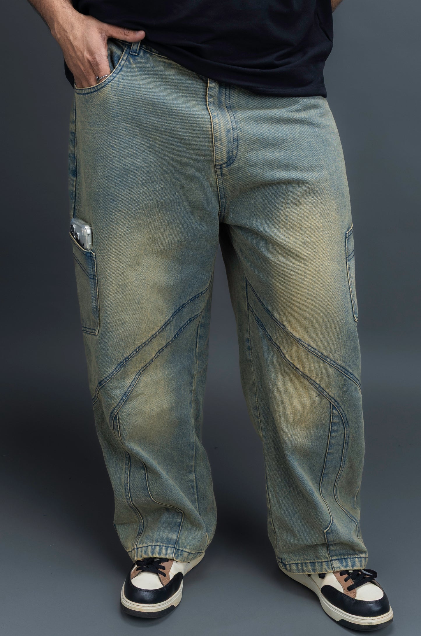 Person wearing baggy vintage jeans by ORE OFE 