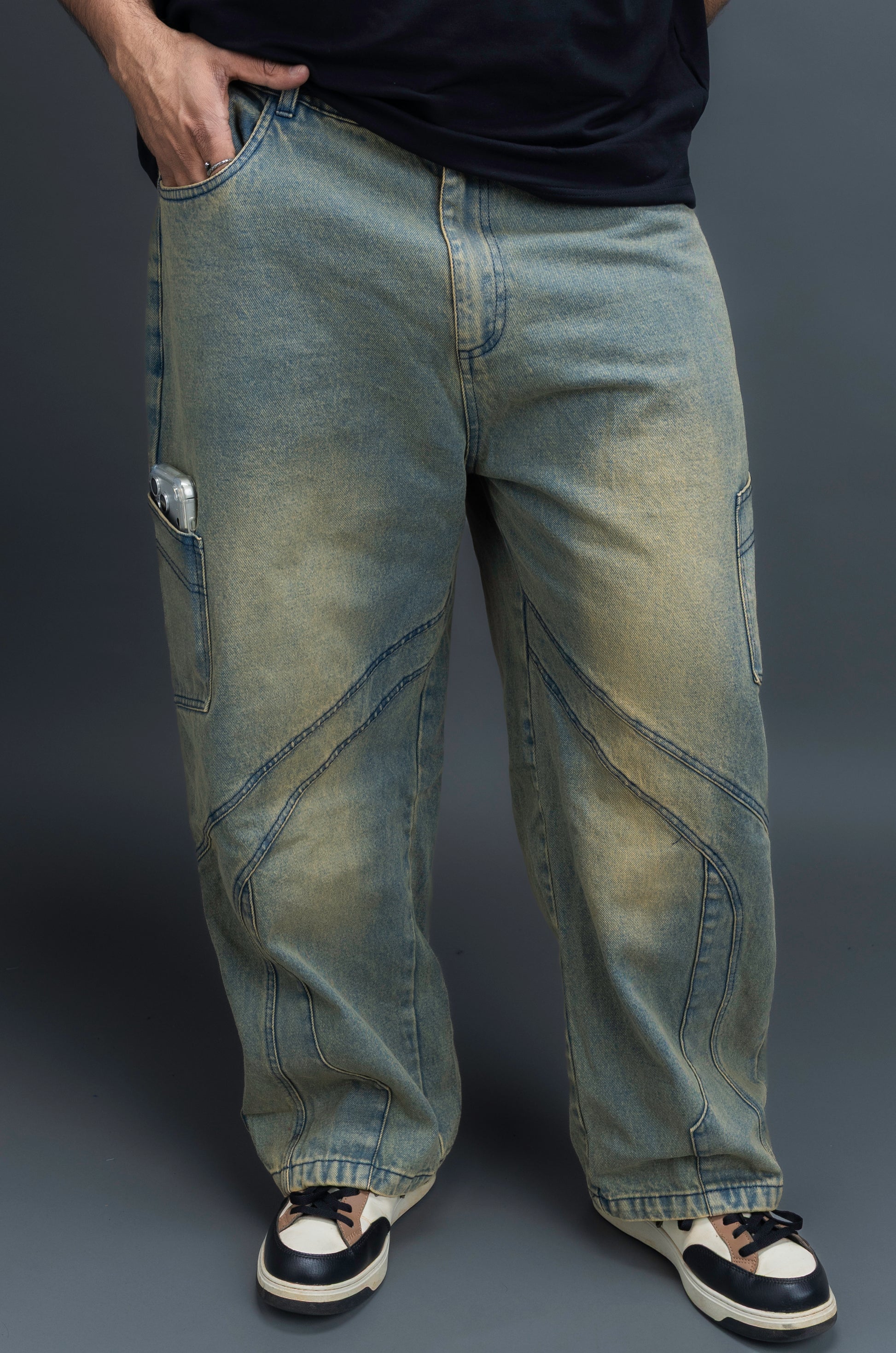 Person wearing baggy vintage jeans by ORE OFE 