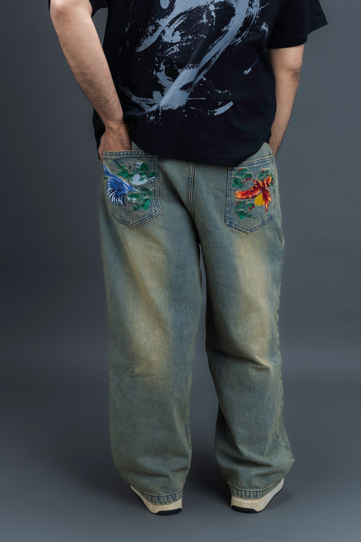 Person wearing baggy vintage jeans by ORE OFE 