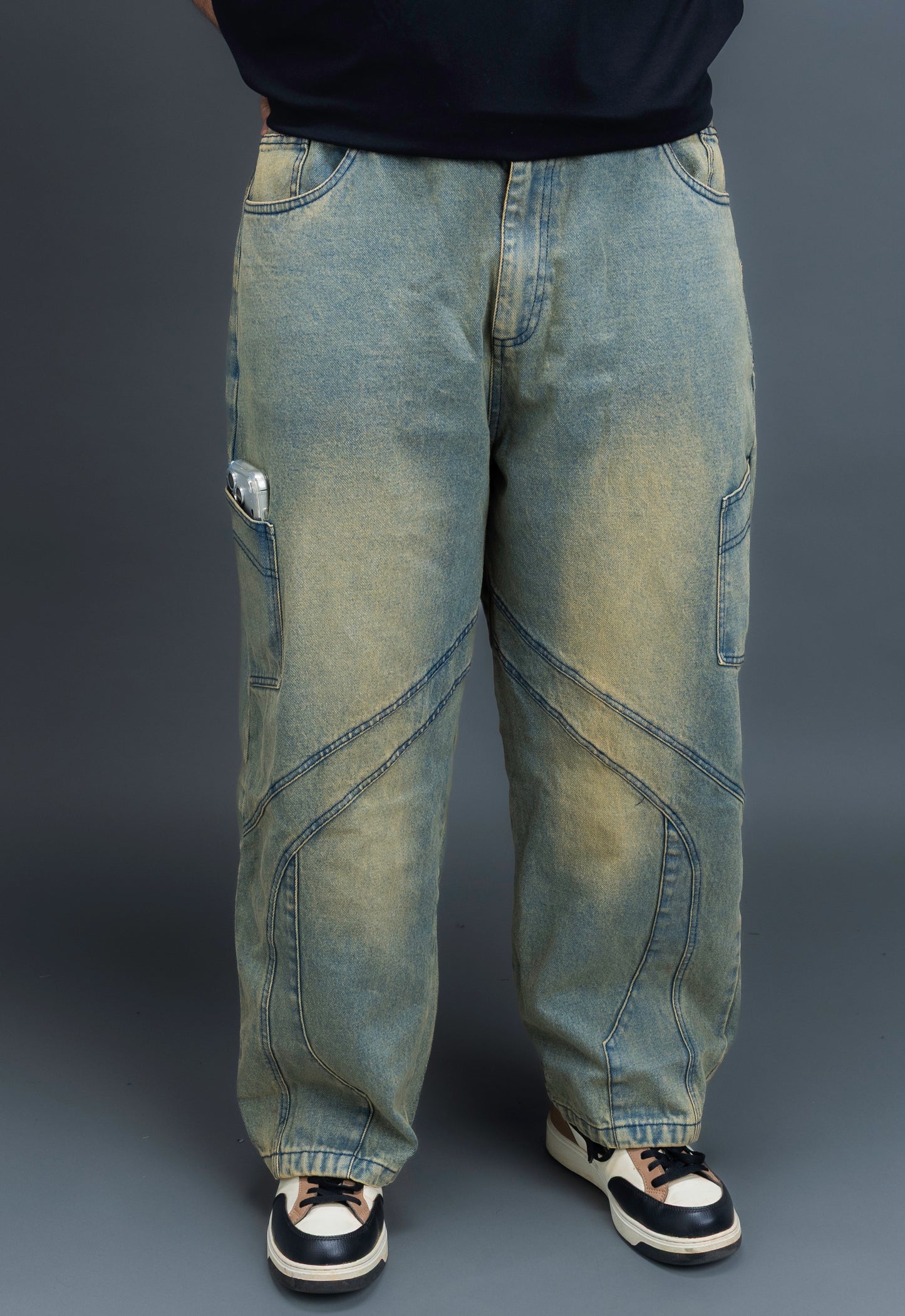 Person wearing baggy vintage jeans by ORE OFE 