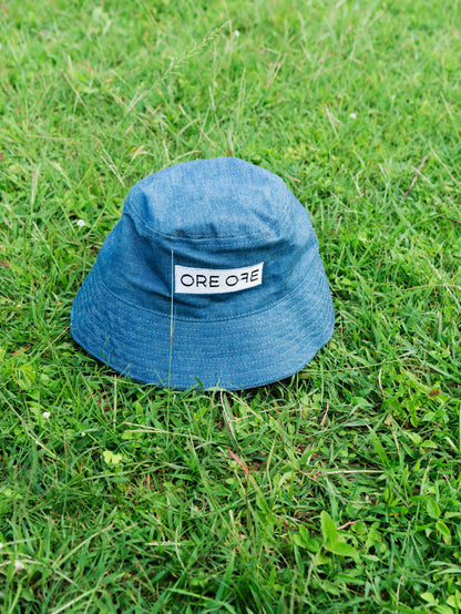 Blue bucket hat with ORE OFE's logo 