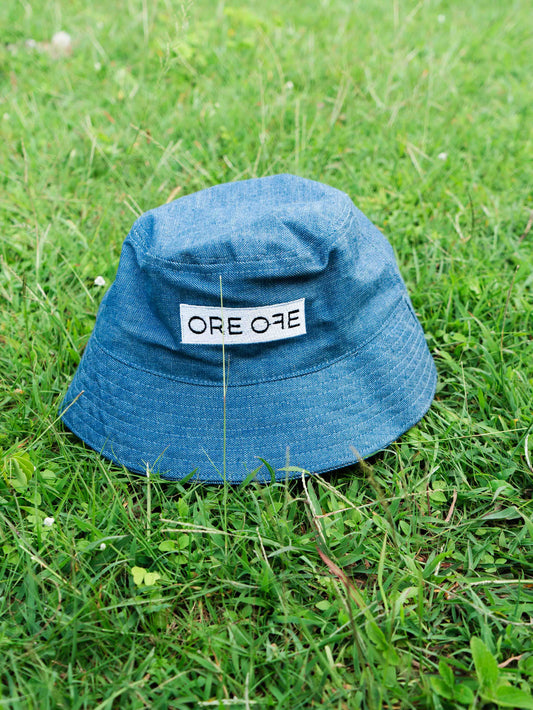 Blue bucket hat with ORE OFE's logo 