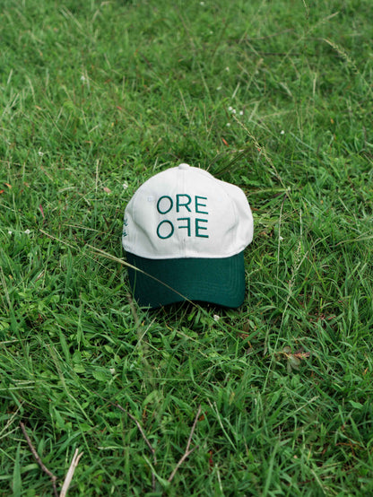White & Green ORE OFE baseball cap with a design that reads minimal efforts club 