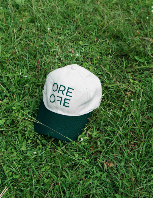 White & Green ORE OFE baseball cap with a design that reads minimal efforts club 