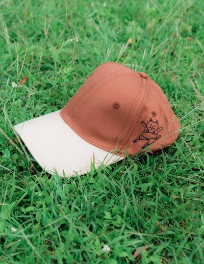 Brown & beige baseball ORE OFE cap with a dancing cat printed on it 