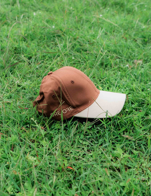 Brown & beige baseball ORE OFE cap with a dancing cat printed on it 