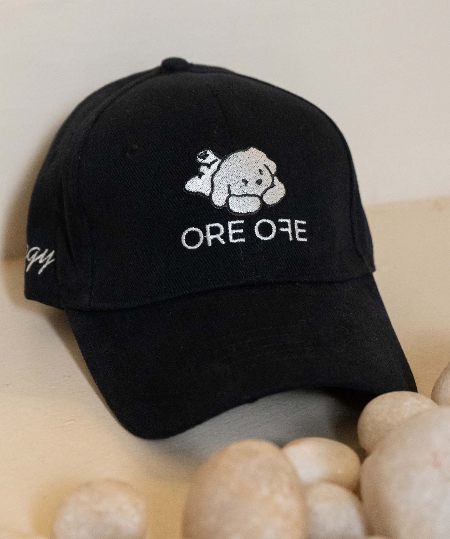 Black ORE OFE cap with a playful dog logo