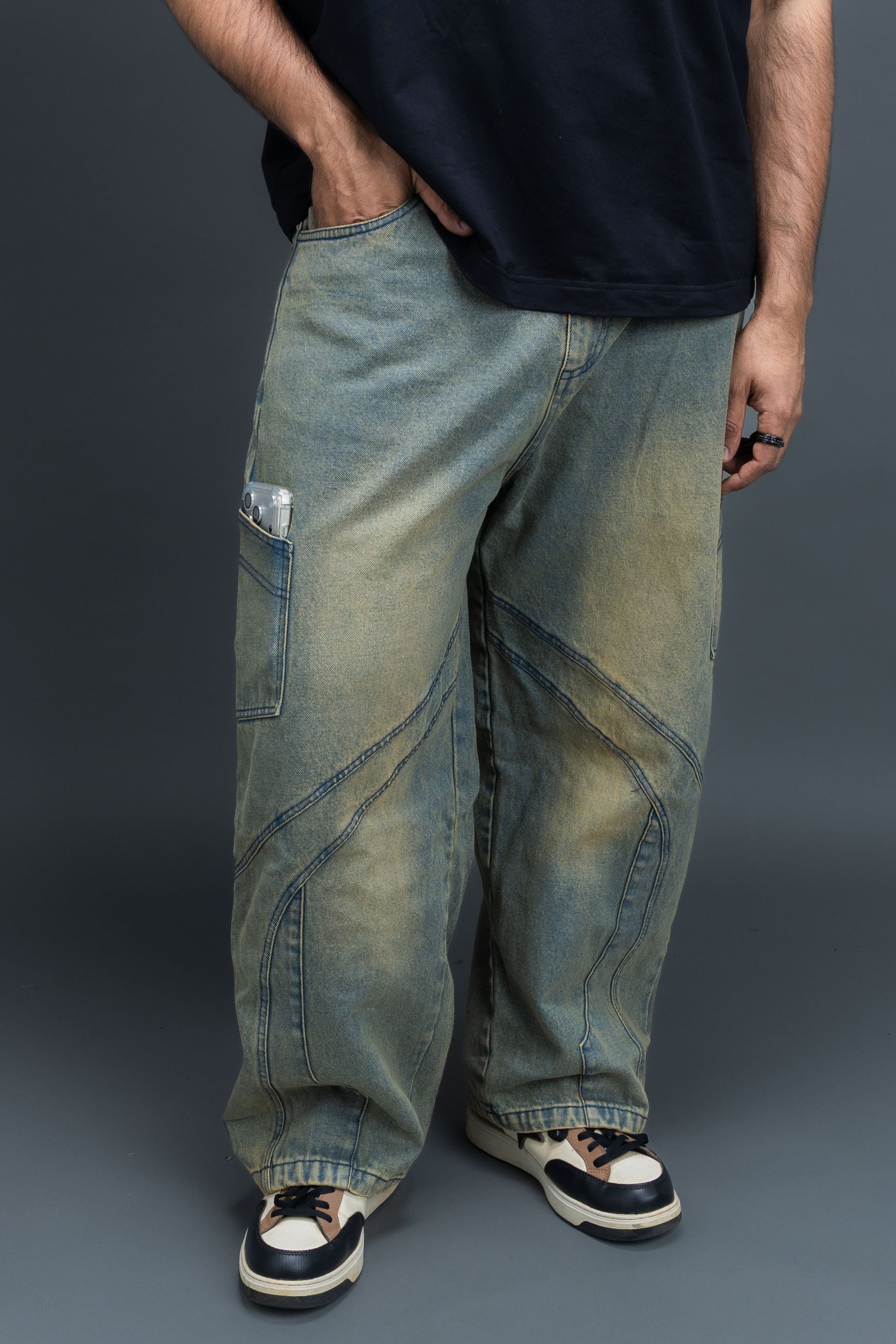 Person wearing baggy vintage jeans by ORE OFE 